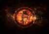 Xhihadistët Kërkojnë Mbështetje me Bitcoin Logo e një monedhe virtuale bitcoin si në zjarr me ngjyre verdhe e kuq ne sfond te zi